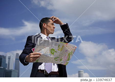 Senior Executive lost with a map in hand 13974637