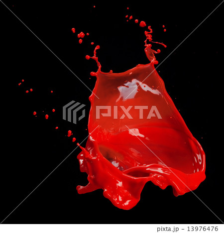 splash of red paint isolated on black 13976476
