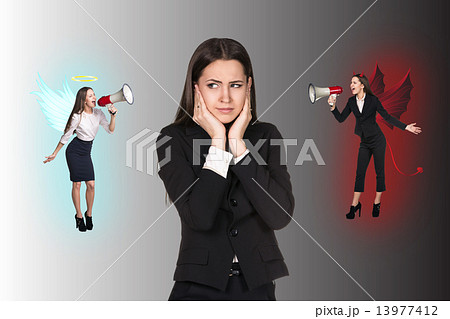 Young businesswoman making choice between good and bad Young businesswoman making choice between good and bad 13977412