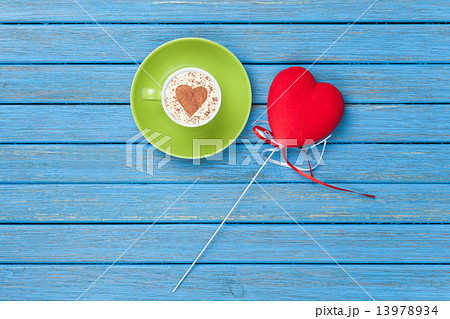Cup of Cappuccino with heart shape symbol and toy Cup of Cappuccino with heart shape symbol and toy 13978934
