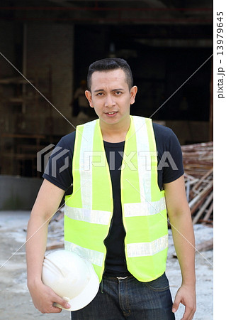 Man holding safety cap 13979645