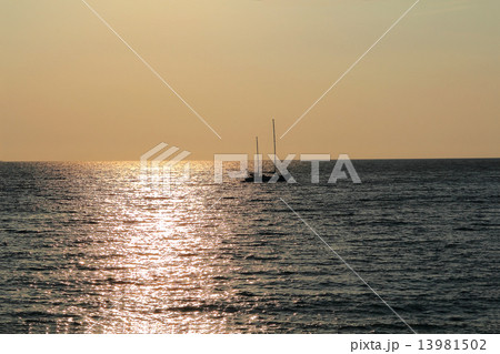 Seascape with calm water and sailboat 13981502