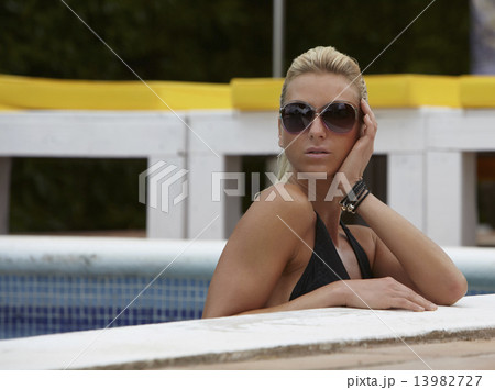 Beautiful Woman in a Swimming Pool During Summer 13982727