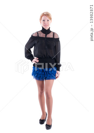 Woman in dress standing on a white background. Woman in dress standing on a white background. 13982871