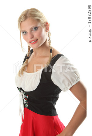 Bavarian Girl dressed in a traditional Dirndl Bavarian Girl dressed in a traditional Dirndl 13982899