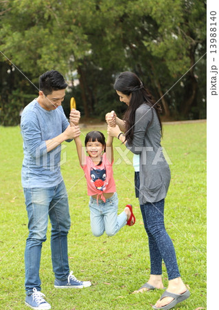 Family playing at park Family playing at park 13988140