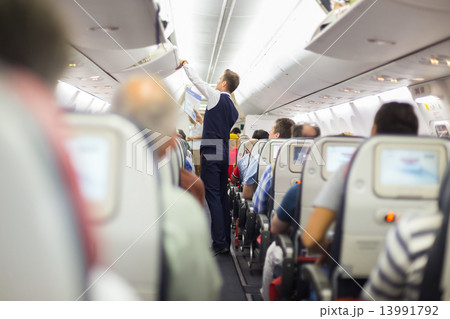 Steward on the airplane. 13991792
