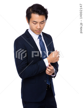 Businessman adjust his cufflink Businessman adjust his cufflink 14002147