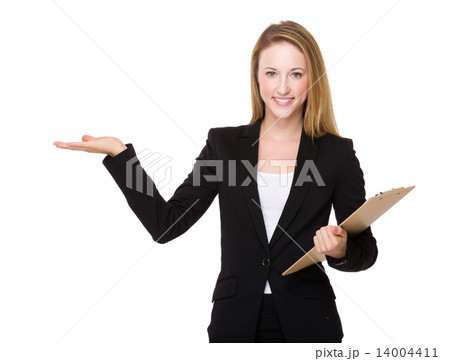 Businesswoman with clipboard and open hand palm Businesswoman with clipboard and open hand palm 14004411
