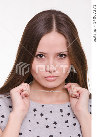 Beautiful girl holds a chain around his neck 14007271