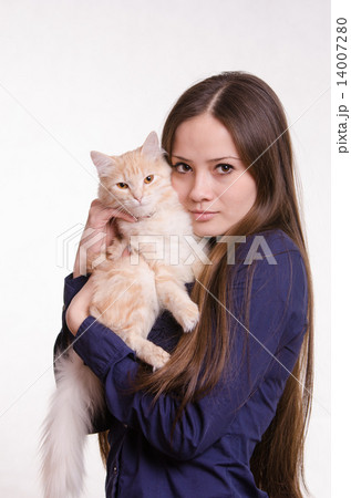 The girl is holding a red cat 14007280