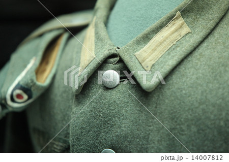 button on a soldier's uniform button on a soldier's uniform 14007812