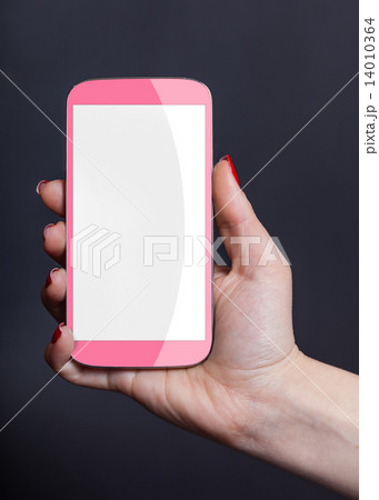 pink mobile phone in a female hand pink mobile phone in a female hand 14010364
