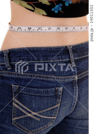 Woman measuring waist. 14011302