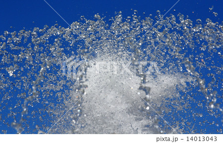 Fountain drops of pure water against a blue sky. Fountain drops of pure water against a blue sky. 14013043