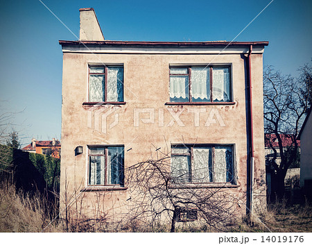 Retro vintage filtered old neglected house exterior. 14019176