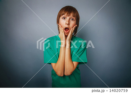 European-looking boy of ten years surprise, opened his mouth on European-looking boy of ten years surprise, opened his mouth on 14020759