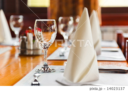 Glasses and plates on table in restaurant Glasses and plates on table in restaurant 14023137