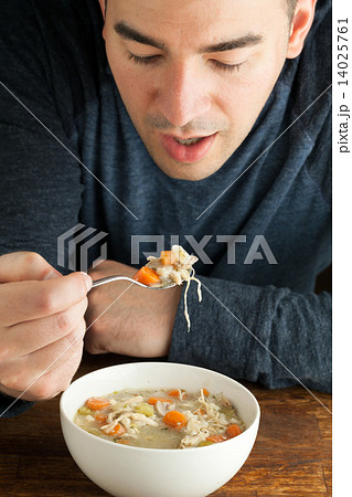 Man Eating Homemade Chicken Soup Man Eating Homemade Chicken Soup 14025761