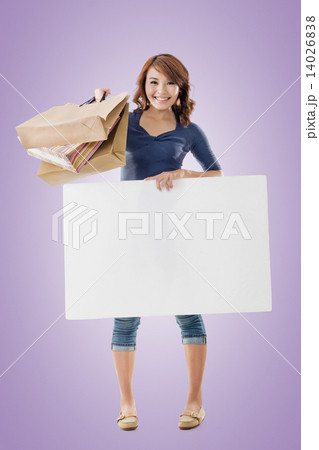 Shopping woman holding bags and blank board 14026838