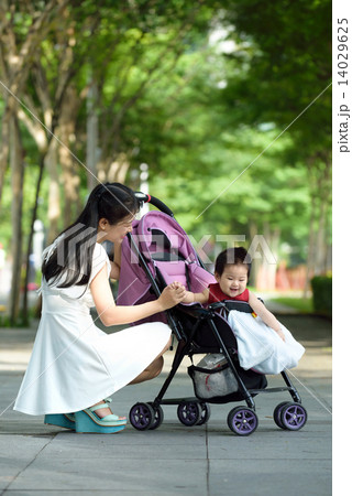 Chinese mother with baby in a stroller 14029625