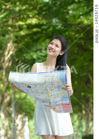 One chinese woman sightseeing along promenade One chinese woman sightseeing along promenade 14029719