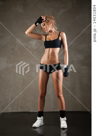 Beautiful fit woman model in black hand bandage 14031804