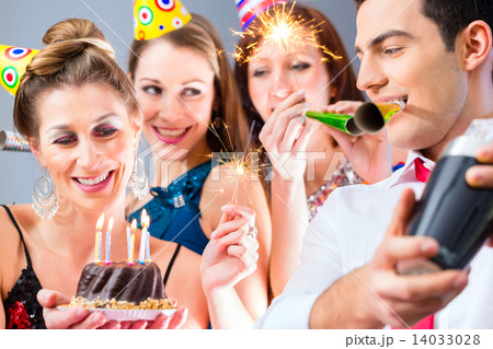 Friends having or new years eve birthday celebration 14033028