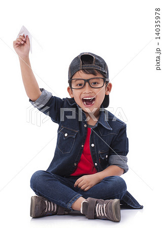 Boy playing with paper airplane Boy playing with paper airplane 14035978