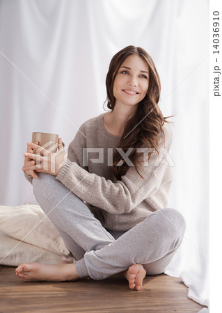 beautiful woman drinking coffee, sitting by window 14036910