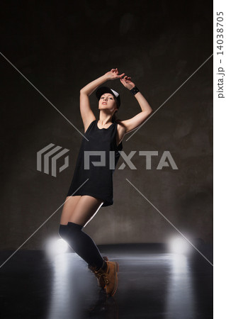 Sexy young woman in a trendy clothes over black background 14038705