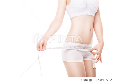 Slimming woman measuring hip with tape 14041512