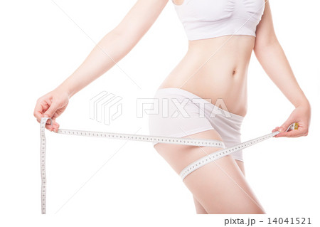 Slimming woman measuring thigh with tape 14041521