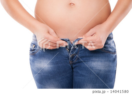 Pregnant belly; woman wearing jeans Pregnant belly; woman wearing jeans 14041580