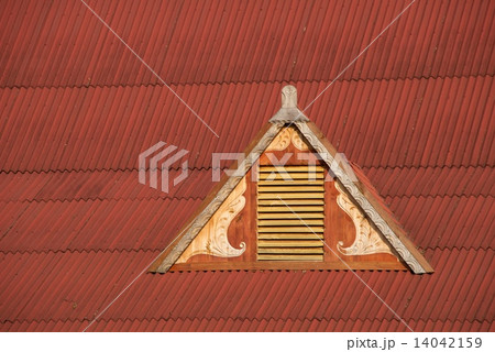 Dormer window in red corrugated iron roof 14042159