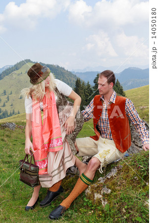 Couple flirting in the Bavarian costumes 14050180