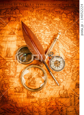 Vintage magnifying glass lies on an ancient world map 14052224