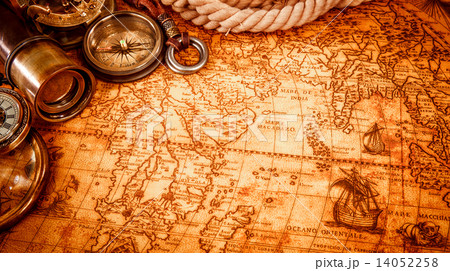 Vintage magnifying glass lies on an ancient world map 14052258