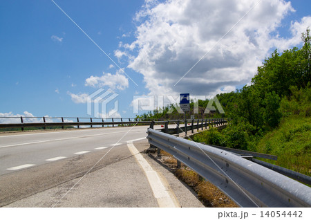 Rural freeway with iron fence and pointe 14054442
