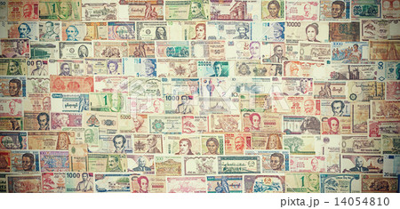 Retro filtered picture of banknotes from all over the world. 14054810