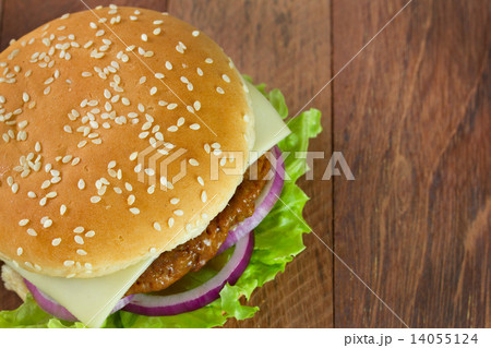 cheeseburger on brown table cheeseburger on brown table 14055124