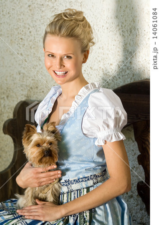 Young Bavarian beauty with dog Young Bavarian beauty with dog 14061084