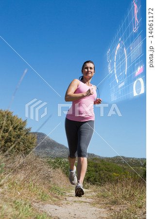 Composite image of active woman jogging in the countryside Composite image of active woman jogging in the countryside 14061172