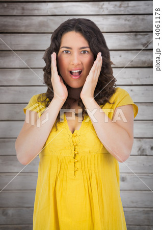 Composite image of disgusted casual young woman posing Composite image of disgusted casual young woman posing 14061178