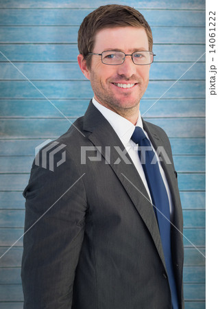 Composite image of handsome businessman smiling at camera Composite image of handsome businessman smiling at camera 14061222