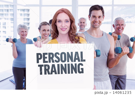 Composite image of pretty redhead showing a card 14061235