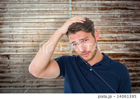 Composite image of handsome young man looking confused Composite image of handsome young man looking confused 14061395