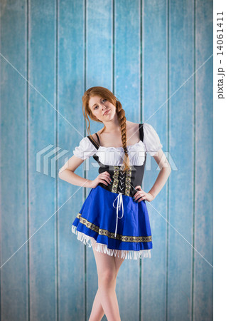 Composite image of oktoberfest girl looking at camera 14061411