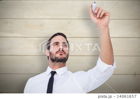 Composite image of focused businessman writing with marker Composite image of focused businessman writing with marker 14061657