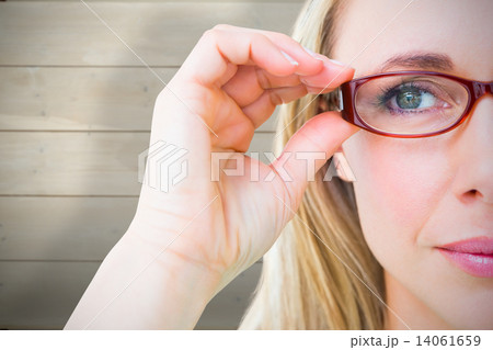 Composite image of close up of pretty blonde with red reading gl Composite image of close up of pretty blonde with red reading gl 14061659